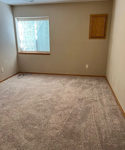 3rd bedroom in basement with daylight windows