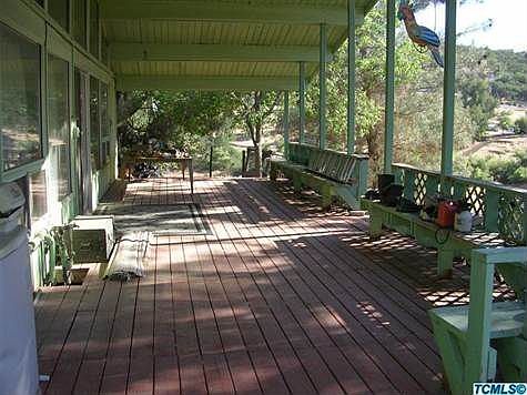 Beautiful long deck runs the side of home with sliders out