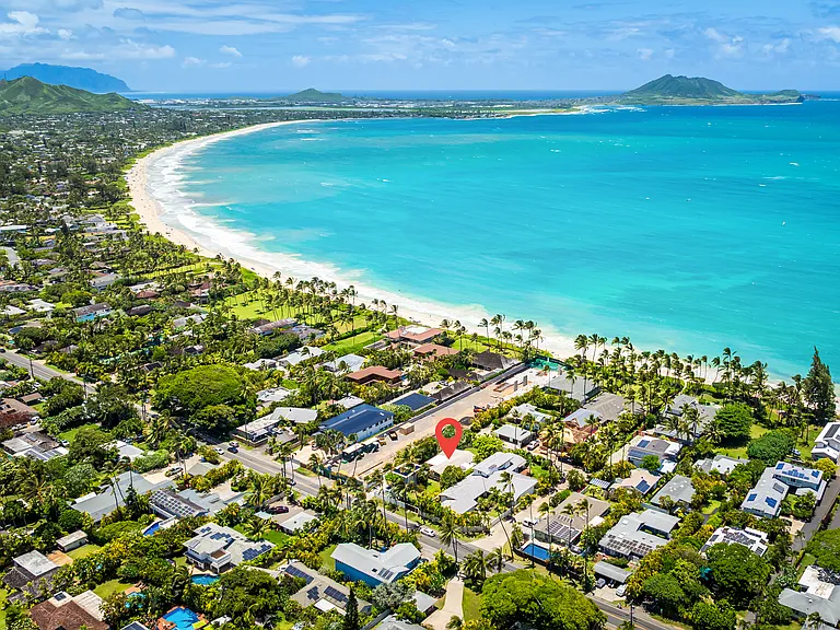 Aerial view of the property's Kailua Beachside location with turquoise ocean views and Marine Corps Base Hawaii in the distance.
