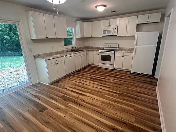 Remodeled kitchen with new cabinets, counters, floors