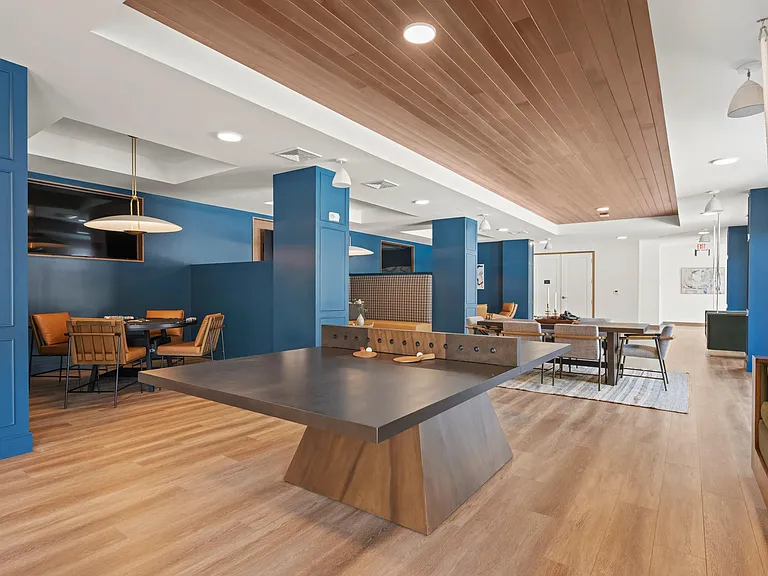 Game room with billiards, ping pong, and poker table.