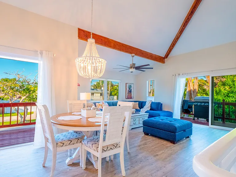 Dining and living room, BBQ on side deck.