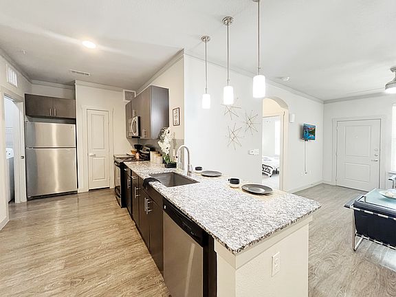 Large kitchen with an island and stainless steel appliances