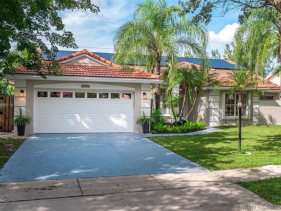 Two garage spaces plus two additional parking spaces on the driveway