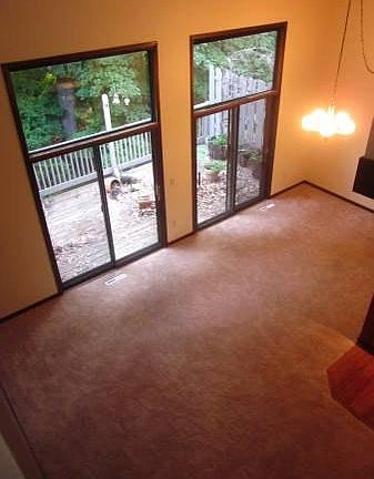 Large living room with sliding doors out to private 36 foot deck