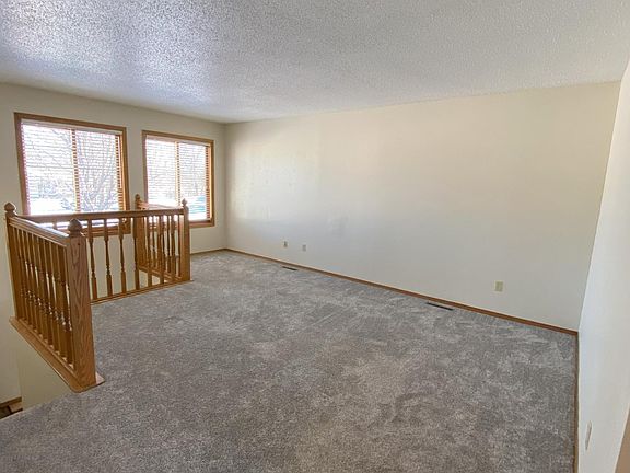 Upstairs living room with large windows