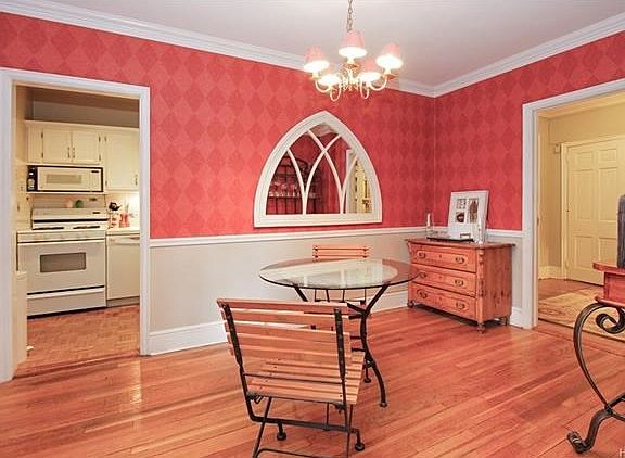 Dining room, with its accent molding, is conveniently located between the kitchen and living room.