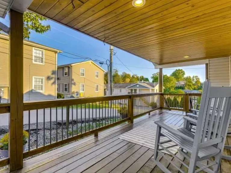 Step out onto the spacious, wrap-around covered porch, perfect for relaxing or entertaining friends while staying shaded from