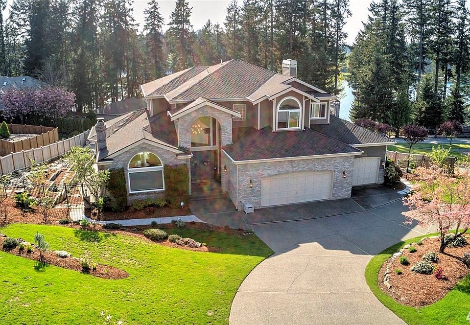Welcome home to this glorious estate home in one of Maple Valley's finest neighborhoods. With over 6000sf of elegant living space and commanding views of Lake Wilderness, you will find that all your wishes can come true right here. From the chef's dream kitchen, to the grand Master Suite with its private deck and sweeping views, to the in-ground pool, hot tub and waterfall features in the beautiful back yard, this luxury home is sure to please. A second Master Suite on the lower level and large area plumbed for a second kitchen provide additional opportunity for Mother-in-law or guest space. Enjoy shared access to the community beach, sport court and dock. 