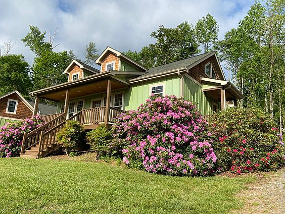 Spring bloom of rhododendrons at front of house