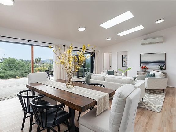 Open floor plan with concertina doors connecting indoors to outdoors