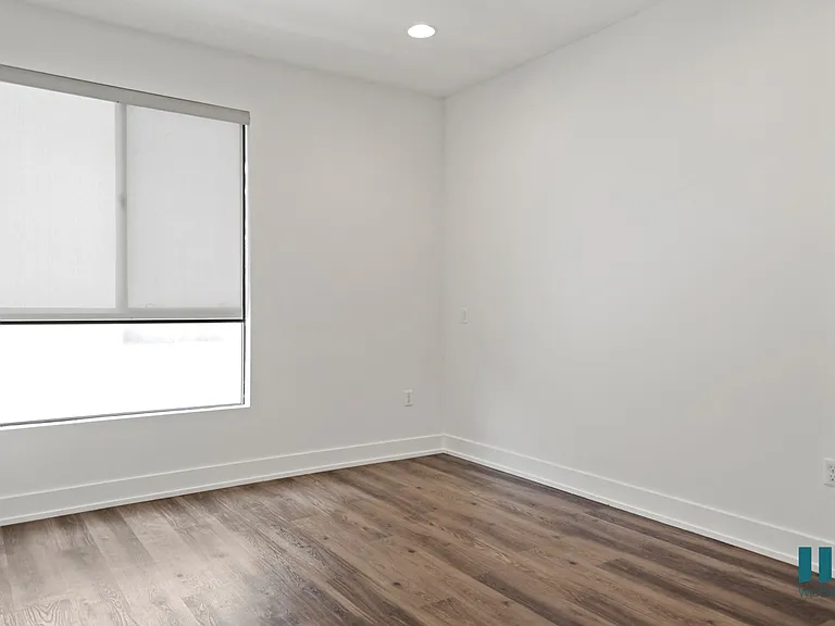 Bedroom with Vinyl Flooring, Recessed Lighting, and Large Windows
