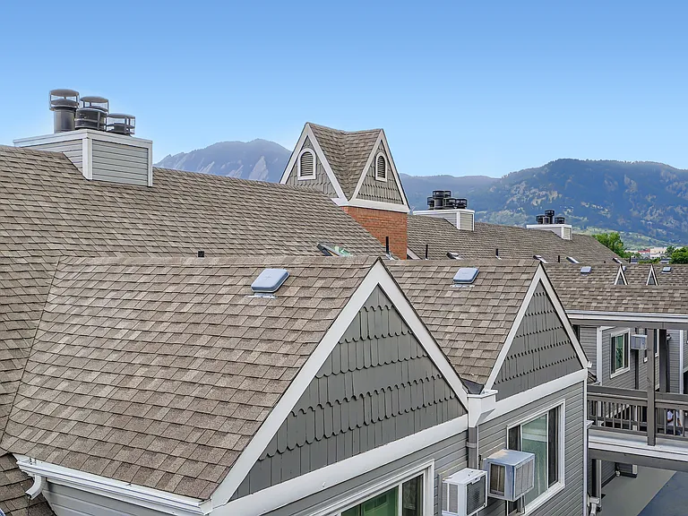 Balcony view southwest from bedroom showing famous Flatiron mountains above Chautauqua Park. Pearl Street's lively pedestrian mall is just 7 blocks away