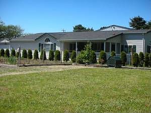 Front of house, with park in front.