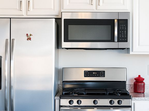 Kitchen comes with stainless steel appliances.