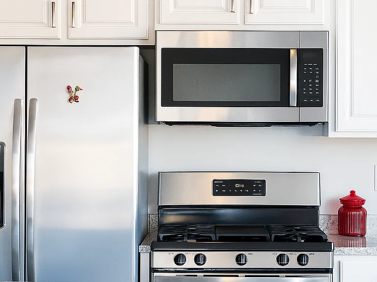 Kitchen comes with stainless steel appliances.