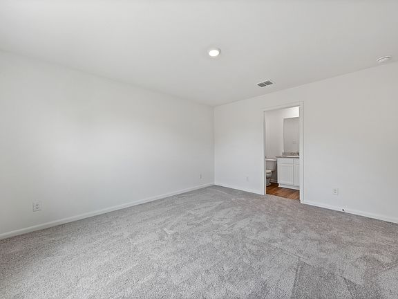 The master retreat has its own bathroom and walk-in closet