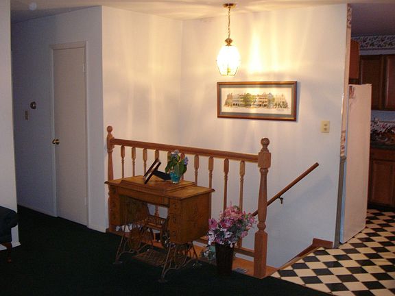 Open air stair well with oak rail