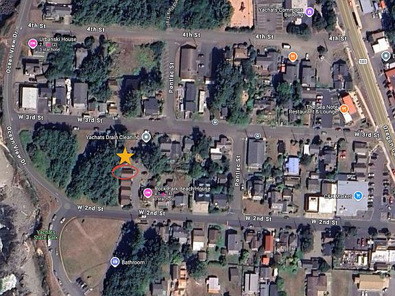 As the aerial view reveals, this charming cottage offers the best of both worlds: tranquil oceanfront living with the convenience of a bustling village just steps away.