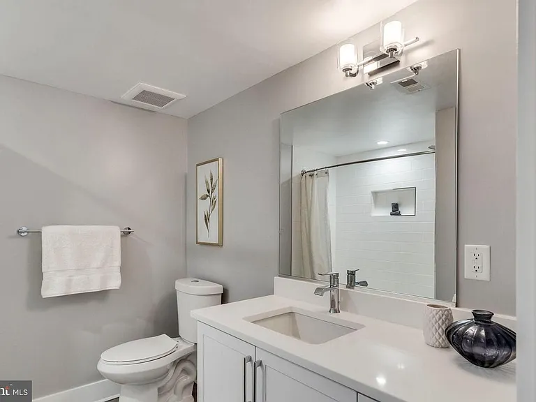 Full bathroom with tub and modern finishes