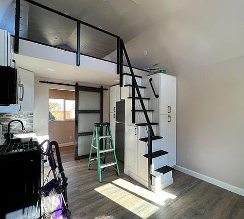 Small living area and showing part of kitchen