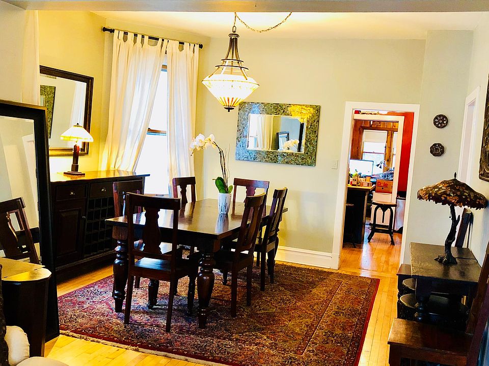Large and bright formal dining with Two Fishes fixture