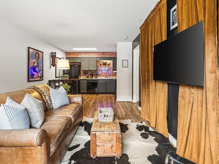 Cozy living room with a smart TV and a sleeper sofa. No stairs in this condo and located on the ground level, for easy access.