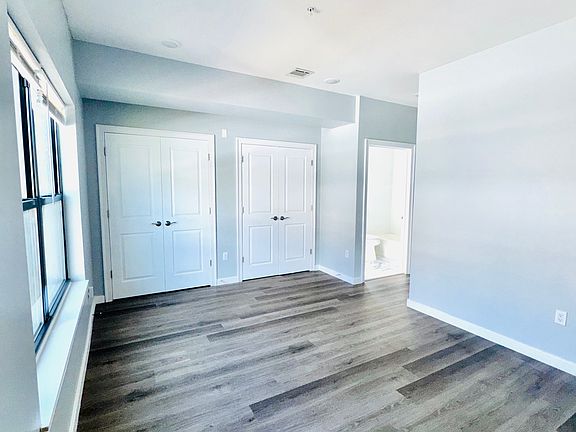 Primary Bedroom with view of 2 closets and ensuite
