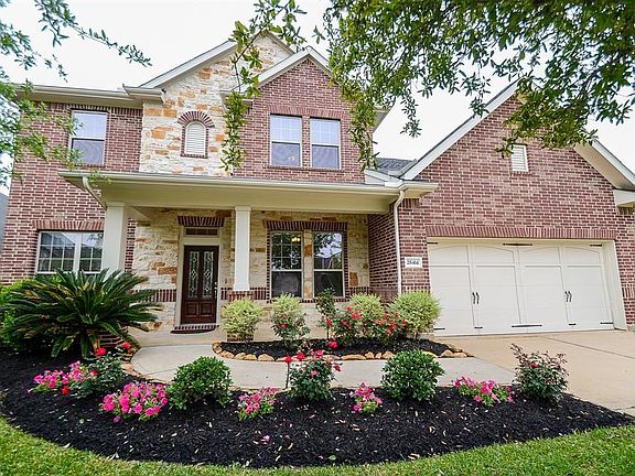 Inviting walk way leading to the porch entering through a wood/stained glass front door.  Energy efficient home with double pane windows, high efficiency HVAC, blown cellulose and radiant barrier. Three car tandem garage with several built in storage areas.