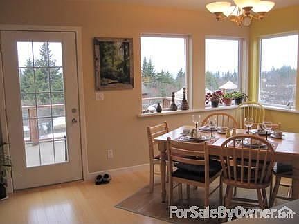 Dining area : Views of the bay and easy access to the deck out the full light door.