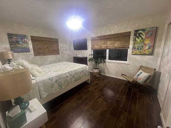 This is bedroom number two it offers a queen bed, and private bathroom