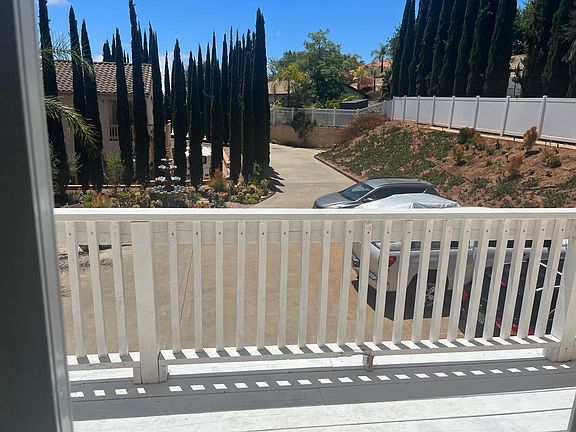 View of the long driveway entrance from the living room and Sundeck