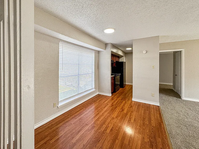 Open-concept living room with natural sunlight at Borders Apartments Brownsville TX.
