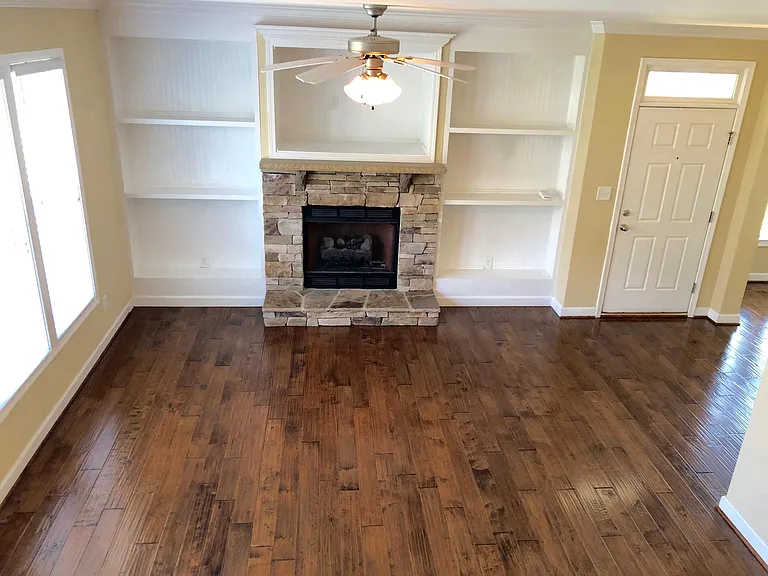 Built ins, gas fireplace, tons of natural light, all wood fl
