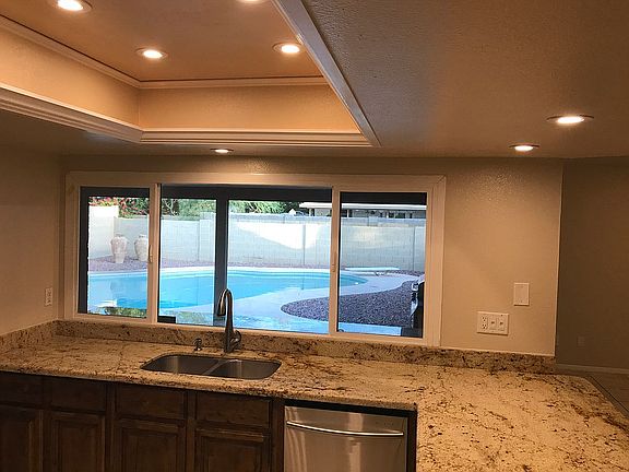 Kitchen overlooks patio/pool
