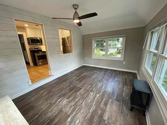 Living Room. Faux Stove Space Heater and Storage Bench included with rental