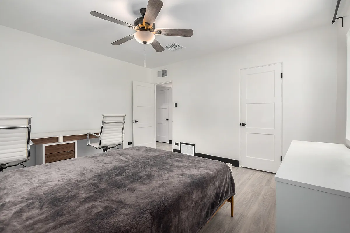 Queen bed, double desk, dresser, 2 walls of IKEA Pax in closet - 102 E 14th St