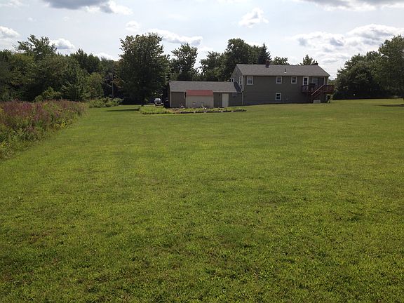 Rear view of house and yard.