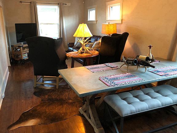 Living Room with original wood floors and high ceilings!