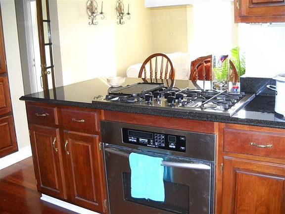 View from the Kitchen Bar
						:
						The sun room can serve as a family sitting area or an informal dining area