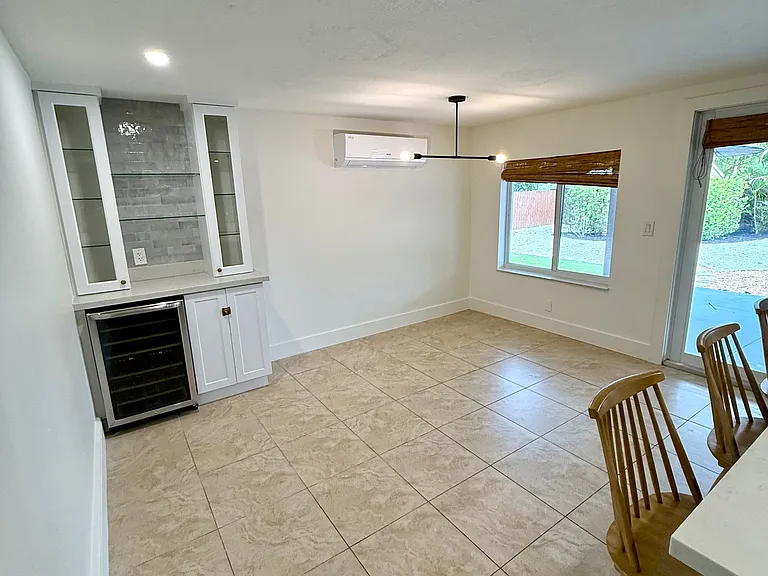 dining + bar area w/ beverage fridge