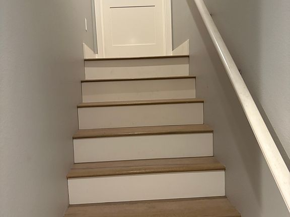 Stairs to bedroom and 1/2 bath