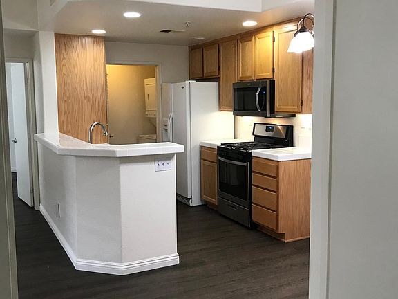 View of kitchen and laundry closet from Bedroom 1.