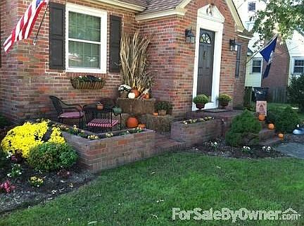 Front - facing South Church St.
						:
						The front features a brick patio, well established beds and japanese maple