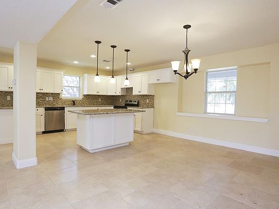 Kitchen opens to dining and Den