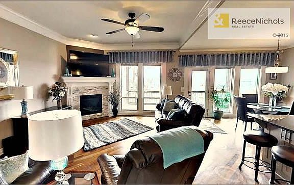 Impressive great room with fireplace, lots of windows and beautiful "hand rubbed" hardwood floors.