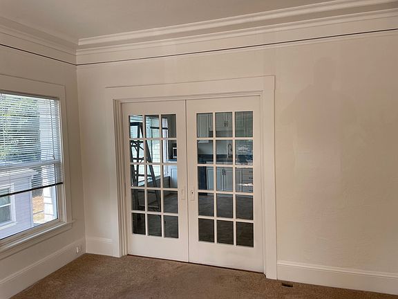 Sliding partition between the kitchen area and the living room.