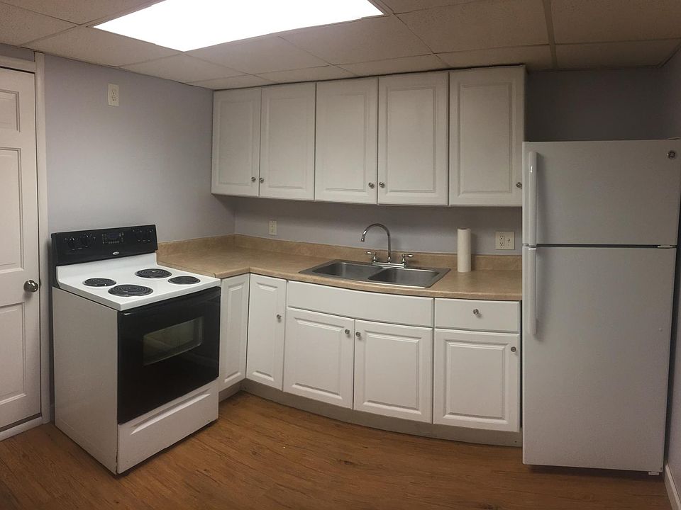 The kitchen includes beautiful cabinets with plenty of storage for all of your needs.
