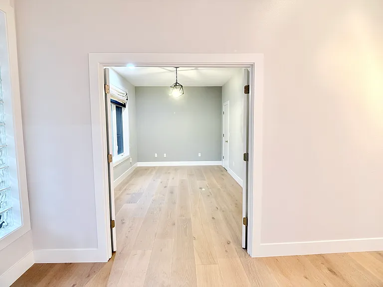 Private office just off the front entry, featuring double doors that can be left open for flow or closed for privacy.