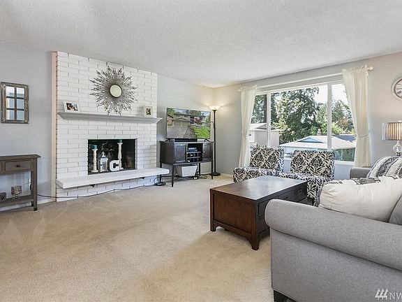 Spacious living room with fireplace.  